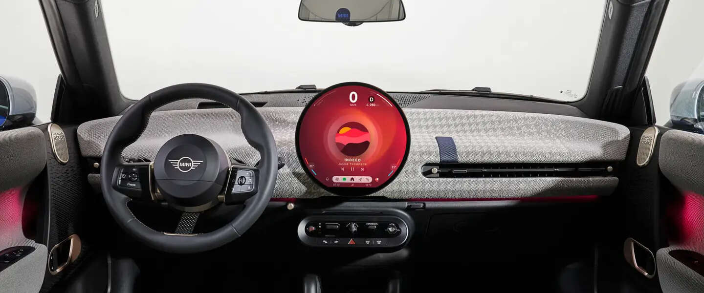 The new electric MINI has a striking, round infotainment screen