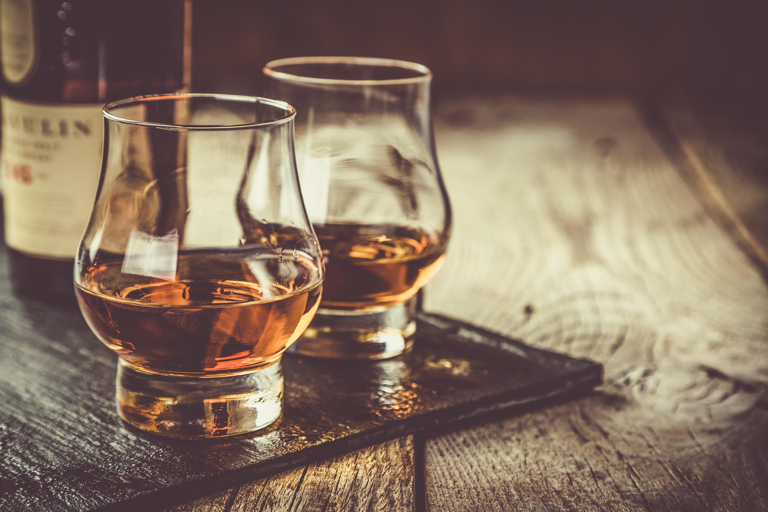 Whiskey with ice in glasses