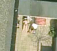 1158562575google-earth-topless.jpg